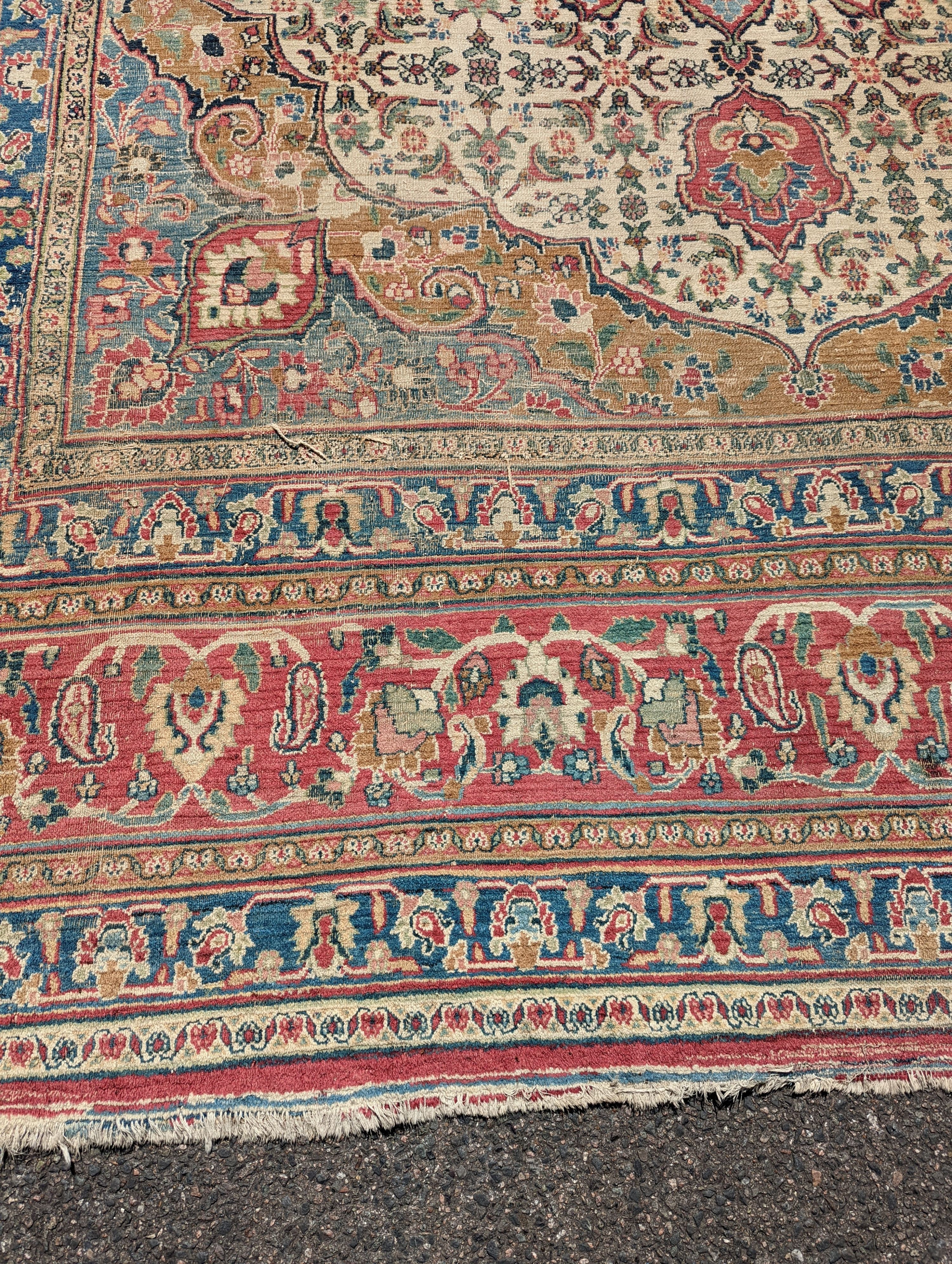 An Isfahan ivory ground carpet, 432 x 330cm